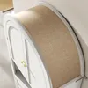 Close-up view of a white cabinet with a curved, tan fabric top. Náhľad obrázku produktu