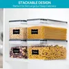 Four clear plastic food storage containers stacked on a white shelf, filled with different dry goods and labeled. Produktbild-Vorschau