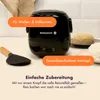 A black mini rice cooker with rice on plates and a rice paddle, with text overlays. Produktbild-Vorschau