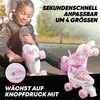A young girl is sitting on the ground, adjusting her roller skates. The roller skates are pink and white. Produktbild-Vorschau