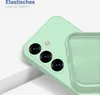 A close-up view of a mint green phone case, showing the camera cutout and the texture of the silicone material. The case is partially covering another identical case. Produktbild-Vorschau