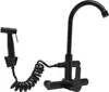 A black faucet with a spray nozzle attached by a coiled hose, mounted on a white background. Podgląd zdjęcia produktu