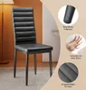 A black dining chair is shown in a room with a floor lamp and a wall. Náhled obrázku produktu