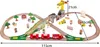 A wooden train set with a crane, track, and accessories arranged on a white background. Podgląd zdjęcia produktu