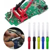A close-up of electronic components and testing equipment. Produktbild-Vorschau