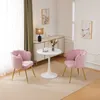 Two pink velvet chairs and a small white table in a well-lit room. Náhľad obrázku produktu