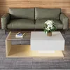 A modern living room scene featuring a green leather sofa and a contemporary coffee table with a glass top and LED lighting. Voir les images du produit