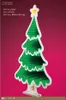 A decorative LED Christmas tree with a star on top, set against a pink background. Produktbild-Vorschau