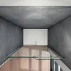 A top-down view of a modern shower enclosure with glass doors and dark gray tiled walls. Produktbild-Vorschau