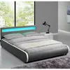 A modern bedroom setup with a bed, nightstand, and lamp. Náhled obrázku produktu