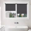 A bathroom with a bathtub and a window covered by roller blinds. Produktbild-Vorschau