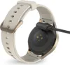 The back of a smartwatch is shown with a charging cable attached. Produktbild-Vorschau