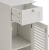 A close-up view of a white cabinet with an open drawer and an open door. Podgląd zdjęcia produktu