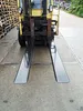 A forklift with its forks extended, parked on a concrete surface next to a stack of wooden pallets. Produktbild-Vorschau