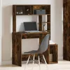 A wooden desk with a shelf unit and a chair in a room. Náhled obrázku produktu