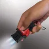 A hand holding a LEGO Darth Vader keychain flashlight with the light on. Anteprima dell’immagine prodotto