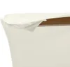 A close-up view of the edge of a white fabric draped over a brown surface. Produktbild-Vorschau