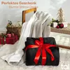 Christmas-themed scene with blankets, gift boxes, and a decorative tree. Náhled obrázku produktu