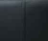 A close-up view of black faux leather with a prominent vertical seam. Produktbild-Vorschau