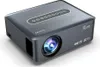 A gray projector is shown on a white background. Voir les images du produit