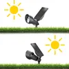 Two solar-powered spotlights are shown on grass, with sun icons indicating their function. Produktbild-Vorschau