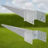Two galvanized steel ground anchors with pointed ends and mounting plates are shown against a blurred background of green grass and a blue sky. Produktbild-Vorschau
