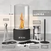 A table fireplace with its accessories laid out on a surface. Produktbild-Vorschau