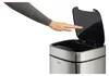 A hand reaching towards a sensor trash can. Podgląd zdjęcia produktu