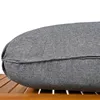 A close-up of a gray cushion on a wooden surface. Podgląd zdjęcia produktu