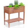 A wooden raised garden bed filled with various herbs and plants, set against a white background. Produktbild-Vorschau