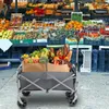 A folding wagon filled with groceries at an outdoor market. Produktbild-Vorschau