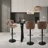 A modern kitchen or dining area with a bar counter and three bar stools. Produktbild-Vorschau