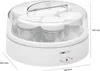 A white yogurt maker with seven glass jars inside, shown from a diagonal angle. Produktbild-Vorschau