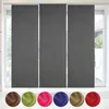 A set of three gray sliding panel curtains hanging in front of a window, with a row of colored fabric swatches below. Náhled obrázku produktu