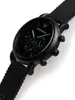 A black Emporio Armani analog watch with a mesh band is shown against a white background. Produktbild-Vorschau