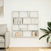 A white cube shelf with 12 compartments is mounted on a white wall. A sofa is visible on the left, and a large green plant is on the right. The shelf contains books, a basket, and decorative items. Voir les images du produit