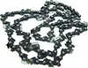 A close-up, coiled view of a black chainsaw chain with silver rivets, laid out on a white background. Produktbild-Vorschau