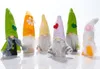 A group of six decorative gnomes are arranged in a line against a white background. Produktbild-Vorschau