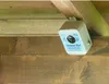 A bird repeller device mounted on wooden beams inside a structure. Anteprima dell’immagine prodotto