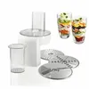 A food processor with attachments and two layered salads in glasses. Produktbild-Vorschau