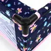 A close-up view of the corner of a navy blue doll's travel bed with a floral and butterfly pattern. The bed has pink trim and a black plastic connector at the corner. Produktbild-Vorschau
