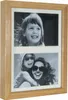 A wooden multi-photo frame with two black and white photos of children. Náhľad obrázku produktu