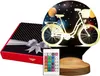 A gift box and a bicycle-shaped LED lamp with a remote control. Produktbild-Vorschau