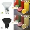 A collage comparing two LED light bulbs and their effect on the color rendering of fruit juices. Produktbild-Vorschau