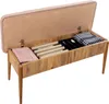 An open storage bench with items inside. Produktbild-Vorschau