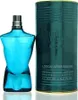 A blue bottle of Jean Paul Gaultier Le Male aftershave lotion and its teal cylindrical packaging are displayed against a white background. Voir les images du produit