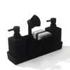 A black soap dispenser set with a brush and sponge holder. Produktbild-Vorschau