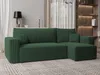 A green sectional sofa is shown in a living room setting with shelves and curtains in the background. Produktbild-Vorschau