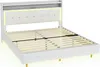A white upholstered bed frame with a slatted mattress support and a headboard with built-in LED lighting and a shelf. Náhľad obrázku produktu