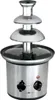 A stainless steel chocolate fountain with two control knobs and a red indicator light on the base. Podgląd zdjęcia produktu